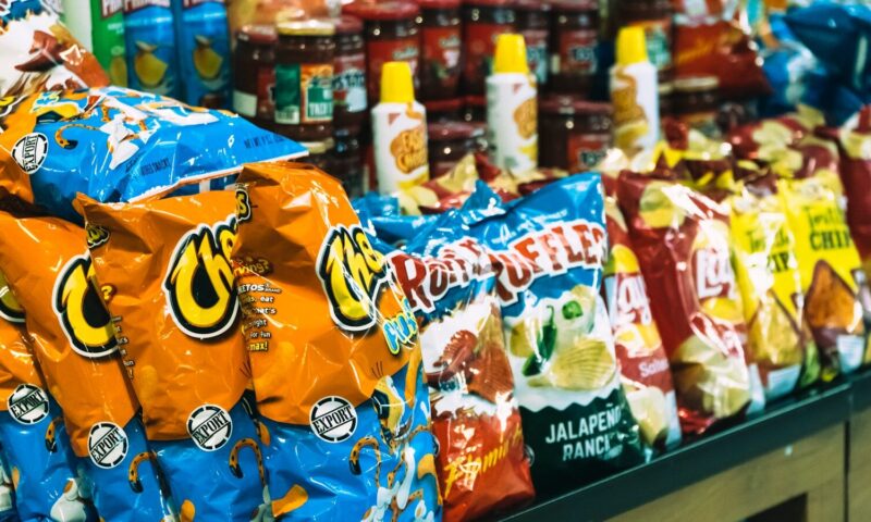 bags of chips are on display in a store